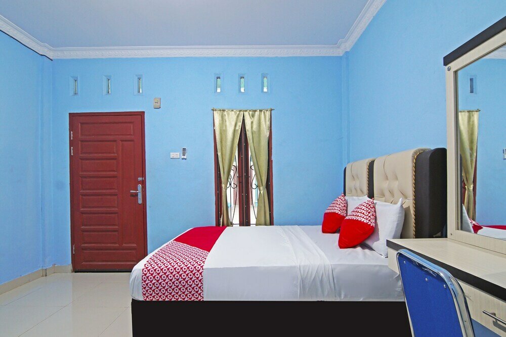 Фото Oyo 90752 Ridho Guest House Syariah