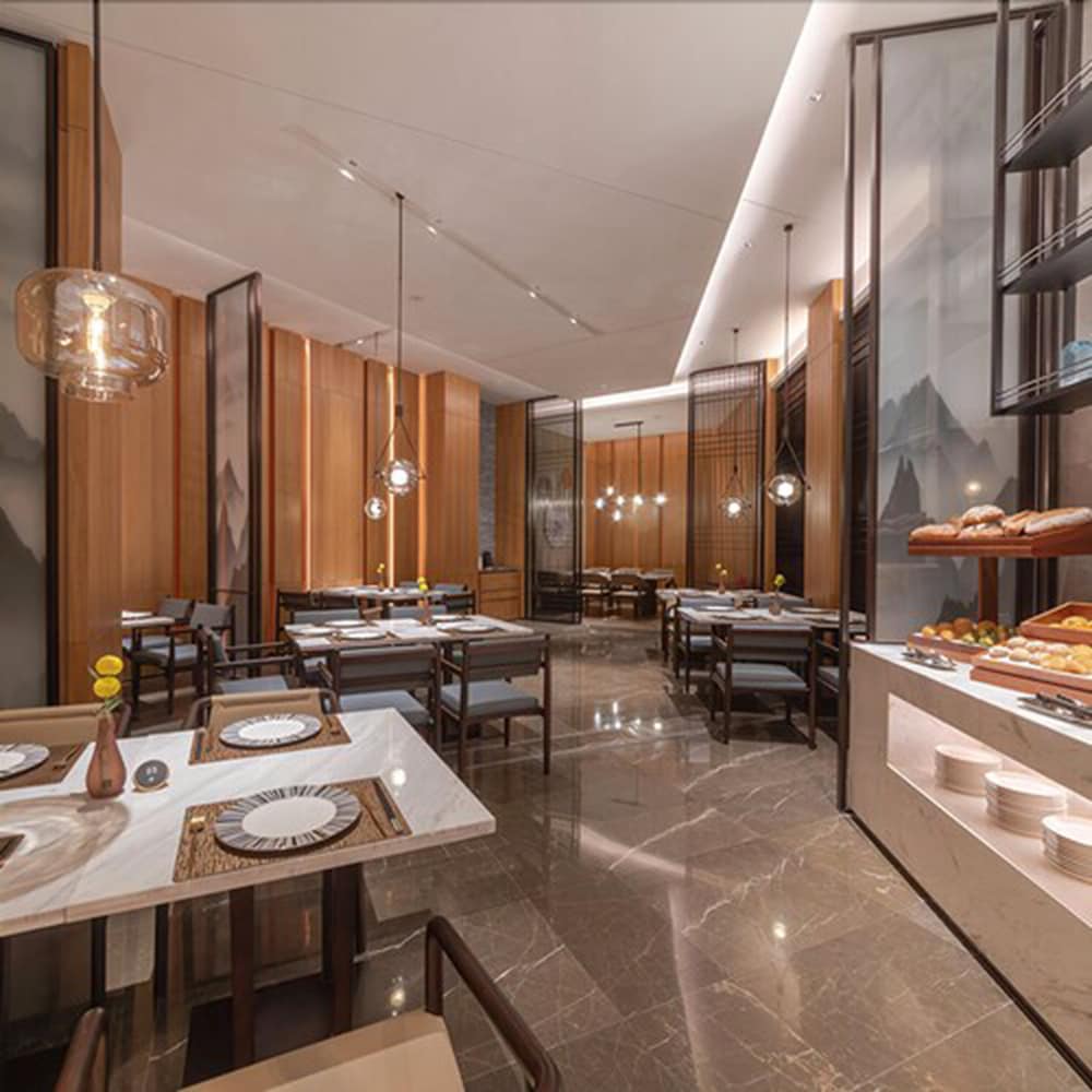 Фото New Century Hotel Zhenhai