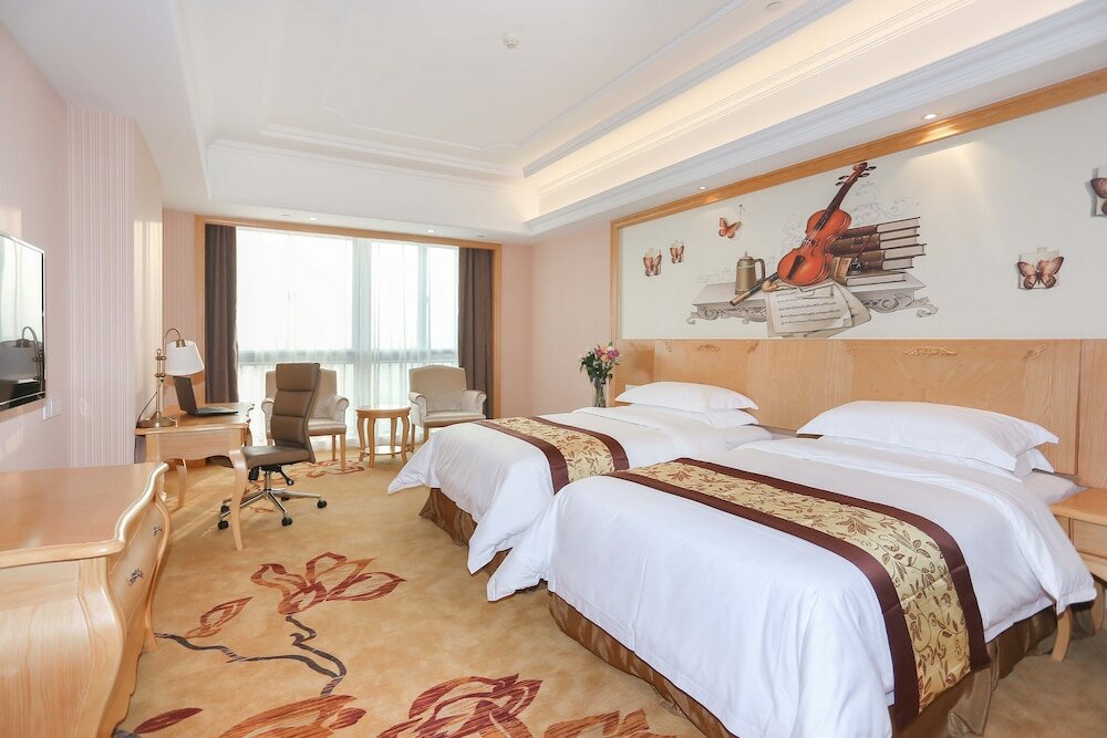 Фото Vienna International Hotel - Ningbo City West Xintiandi
