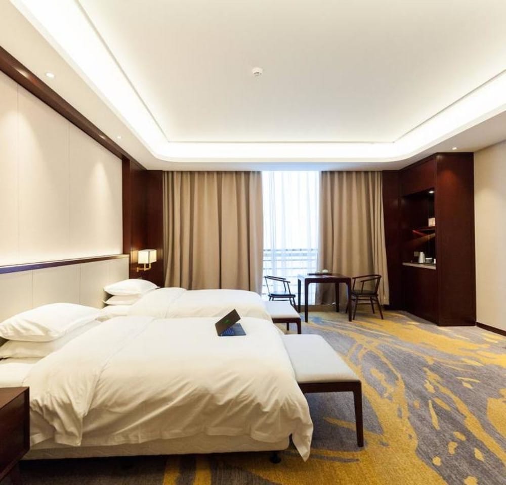 Фото Jinyi Jinglan Hotel