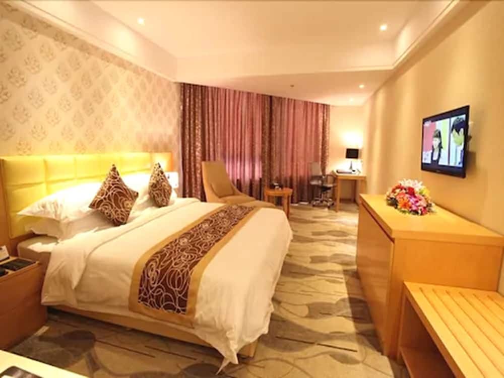 Фото New Beacon Xu Dong International Hotel