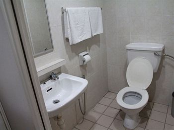 Фото Oyo 615 Dragon Inn Premium Hotel