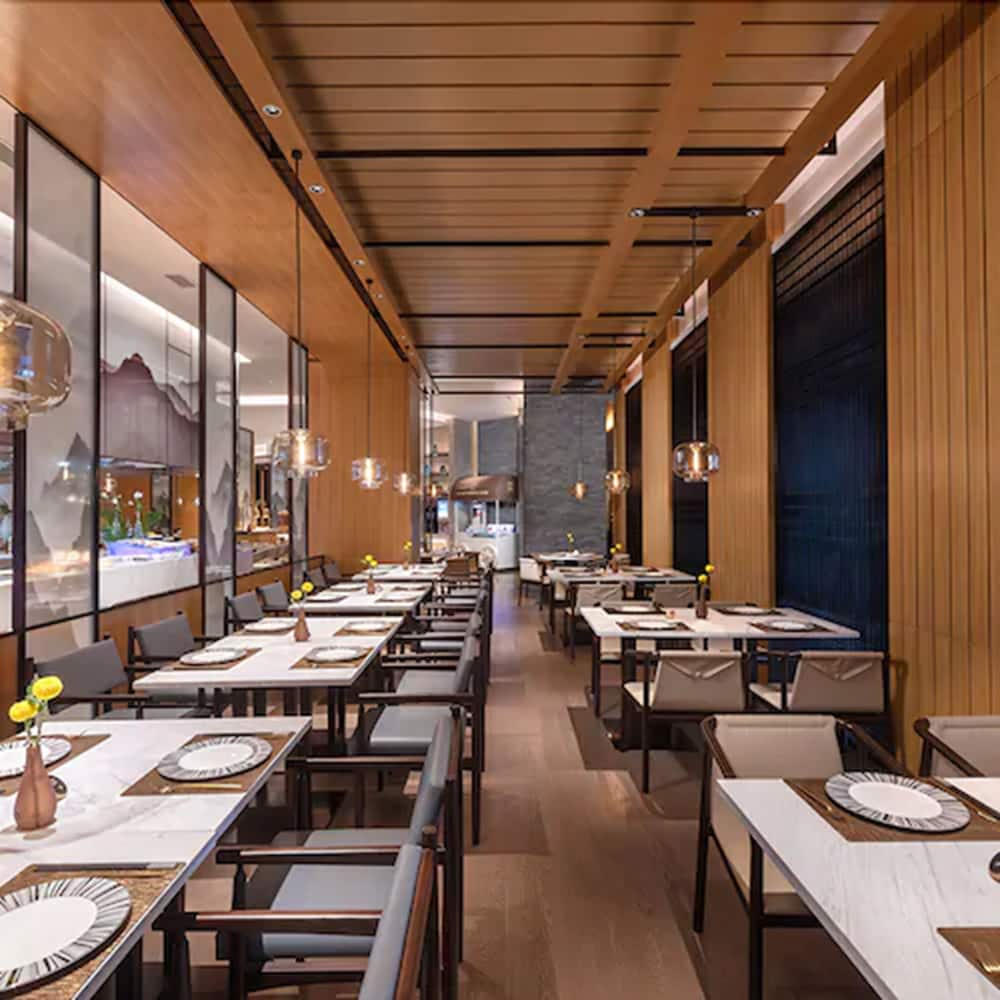 Фото New Century Hotel Zhenhai