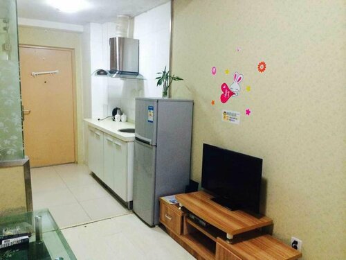 Гостиница Wanda Gold Dragon Holiday Apartment в Циндао