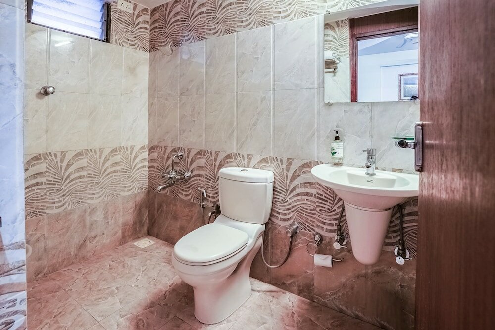 Фото Capital O 48482 Hotel Tribecca Inn