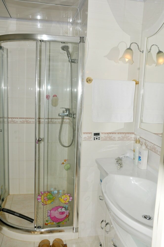 Фото Dalian Xiuzhu Building Apartment