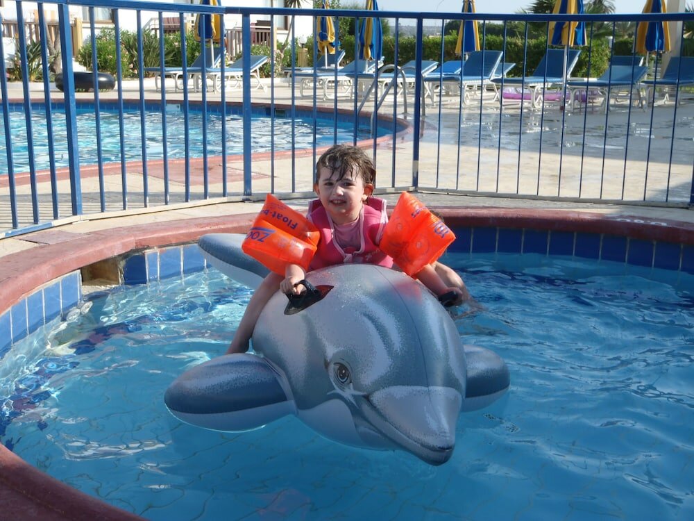 Фото Cosmelenia Hotel Apartments