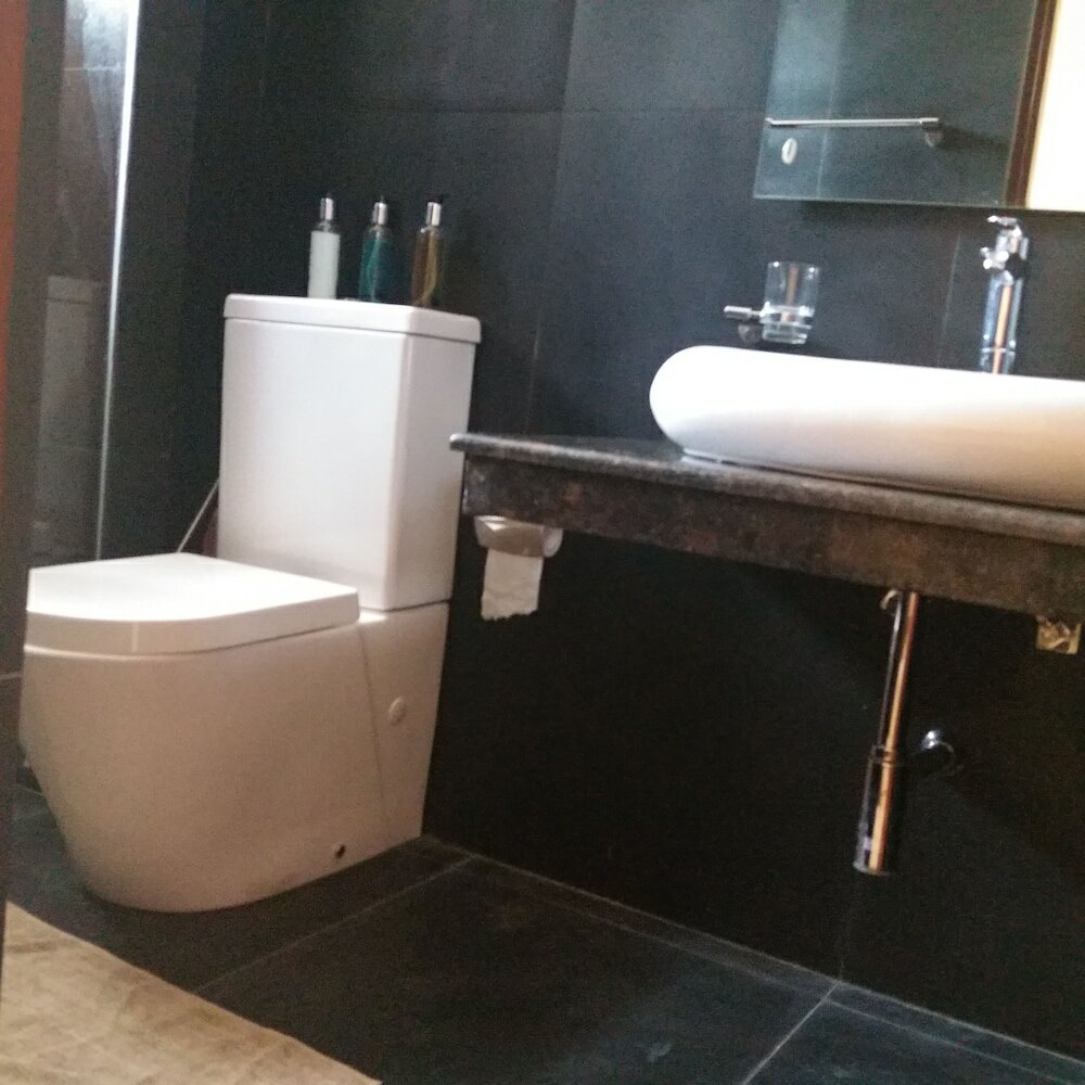 Фото Tj's Apartments