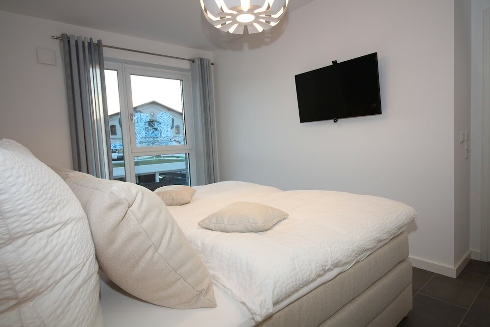 Фото Wohnen am Yachthafen W25