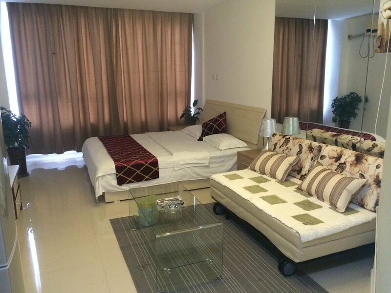 Гостиница Wanda Gold Dragon Holiday Apartment в Циндао