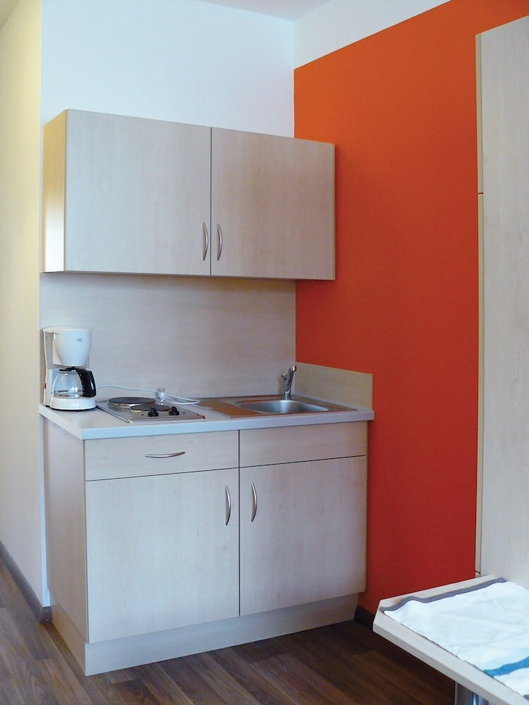 Фото Orange Hotel und Apartments