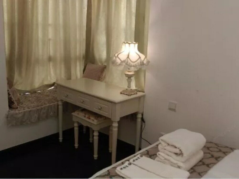 Фото Yumi Apartment-Quan Tian Xia Branch