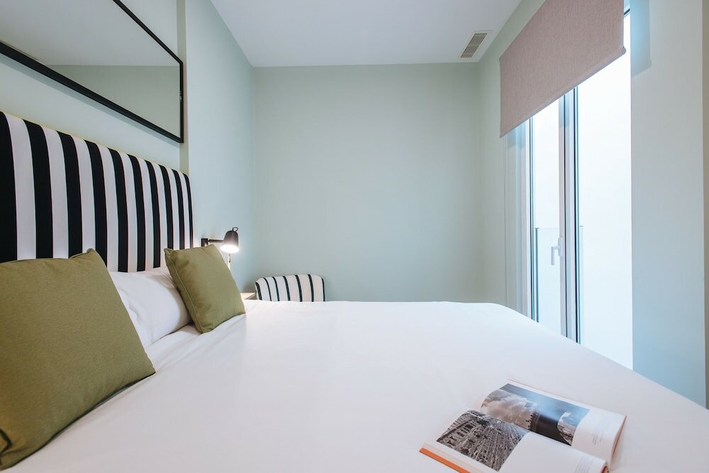 Фото Sercotel Sevilla Guadalquivir Suites