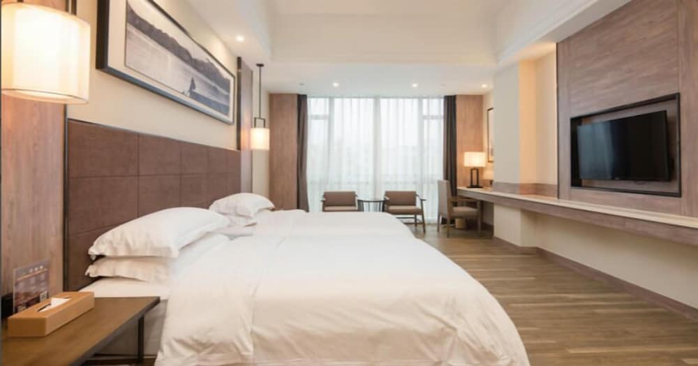 Фото Auden International Hotel