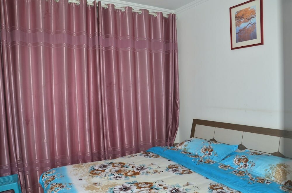 Фото Lanzhou Longshang Mingzhu Apartment Two-bedroom suite