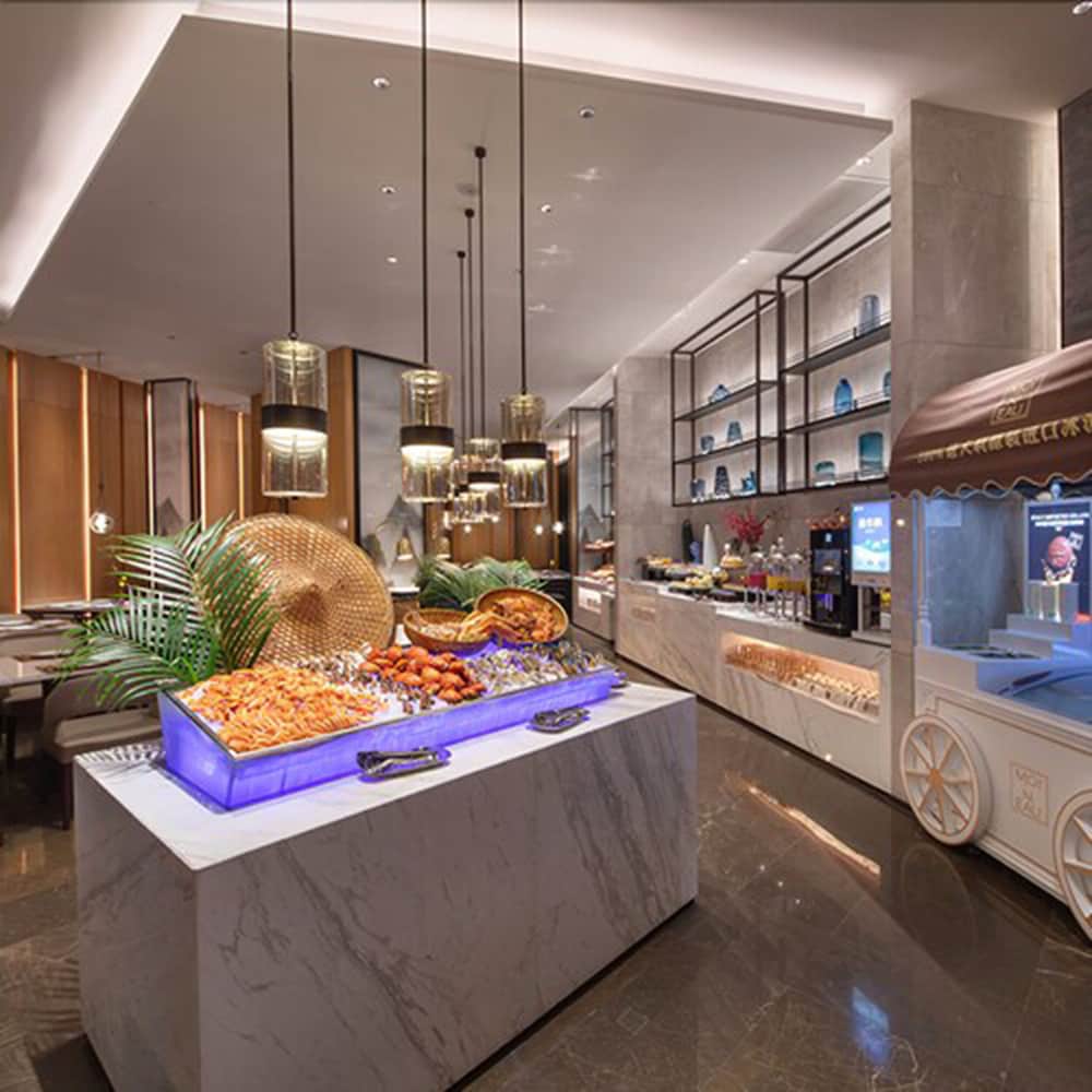 Фото New Century Hotel Zhenhai