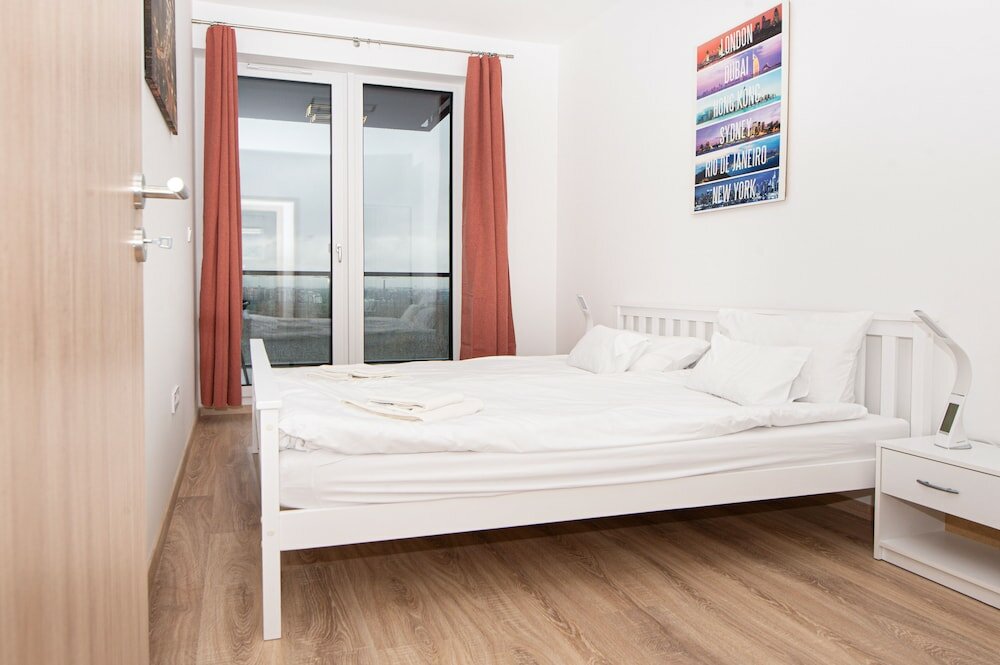 Фото WaterFront City Apartments by UrbanRent