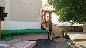 В тапочках