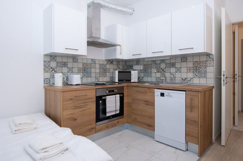 Фото WaterFront City Apartments by UrbanRent