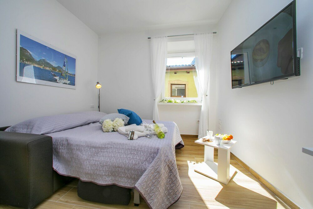 Фото Nido sui Tetti di Riva del Garda