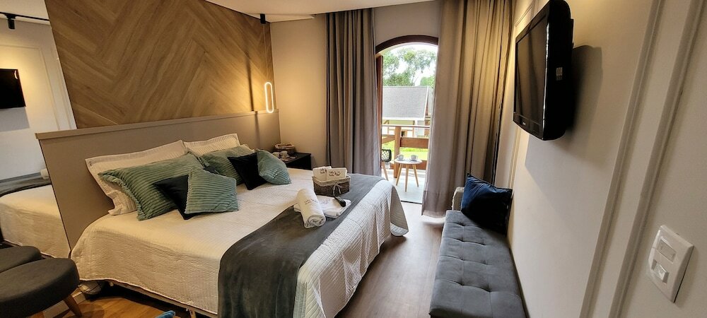 Фото Dúplex Luxo com Piscina Aquecida, Lareira e Wifi