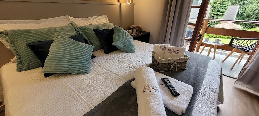 Фото Dúplex Luxo com Piscina Aquecida, Lareira e Wifi