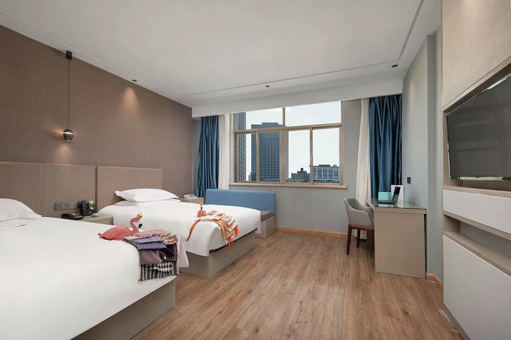 Фото Yiwu Manting City Hotel