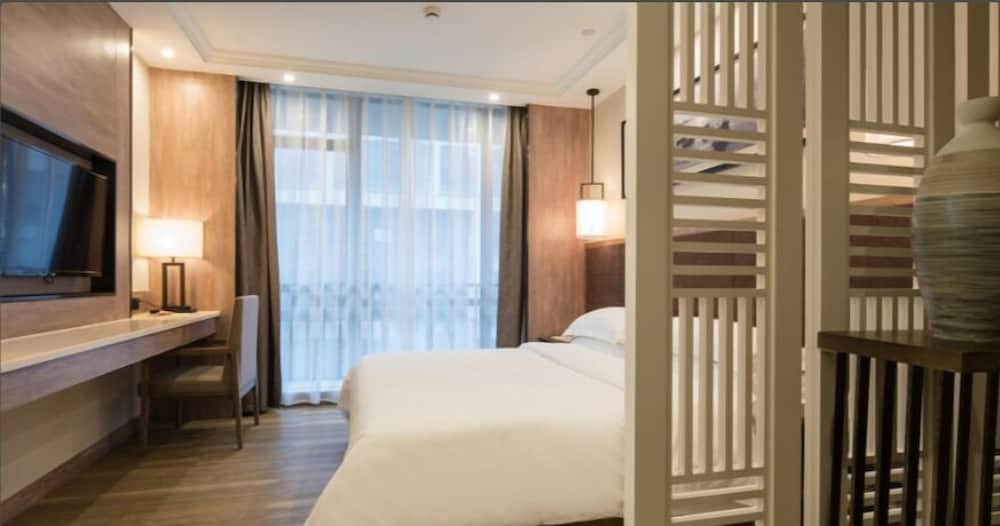 Фото Auden International Hotel