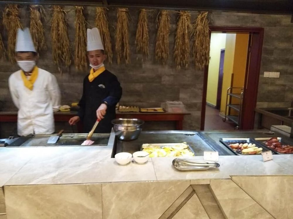 Фото Ramada Encore DaochengYading