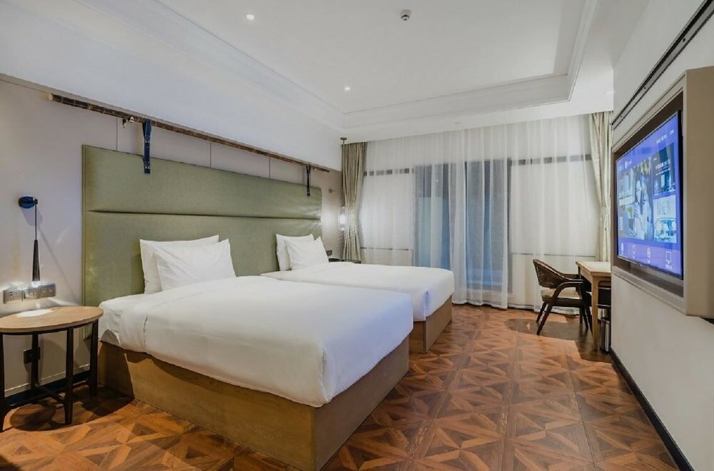 Фото Manxin Hotel Qingdao Zhanqiao