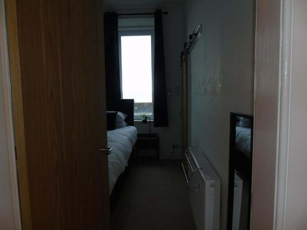 Фото Snug - Sealladh Mara Apartment