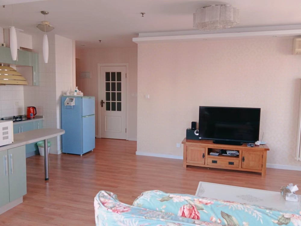 Фото Dalian Xiuzhu Building Apartment