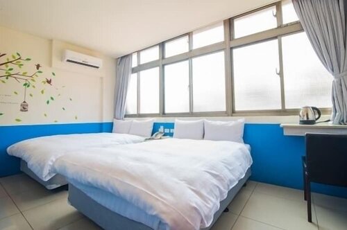 Гостиница Happy Holiday Hotel в Чжунли