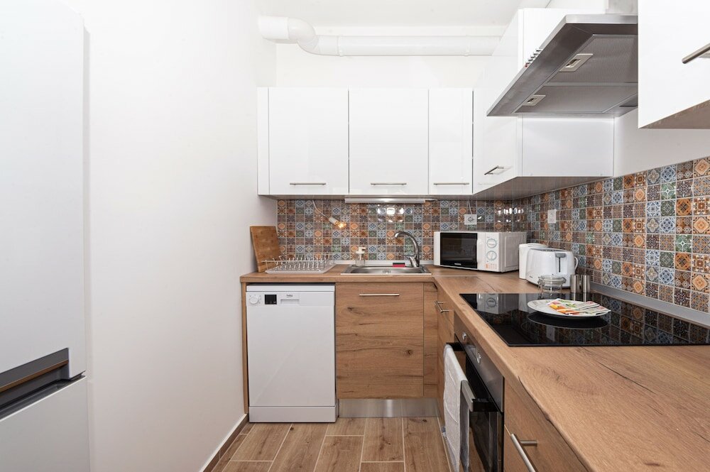 Фото WaterFront City Apartments by UrbanRent