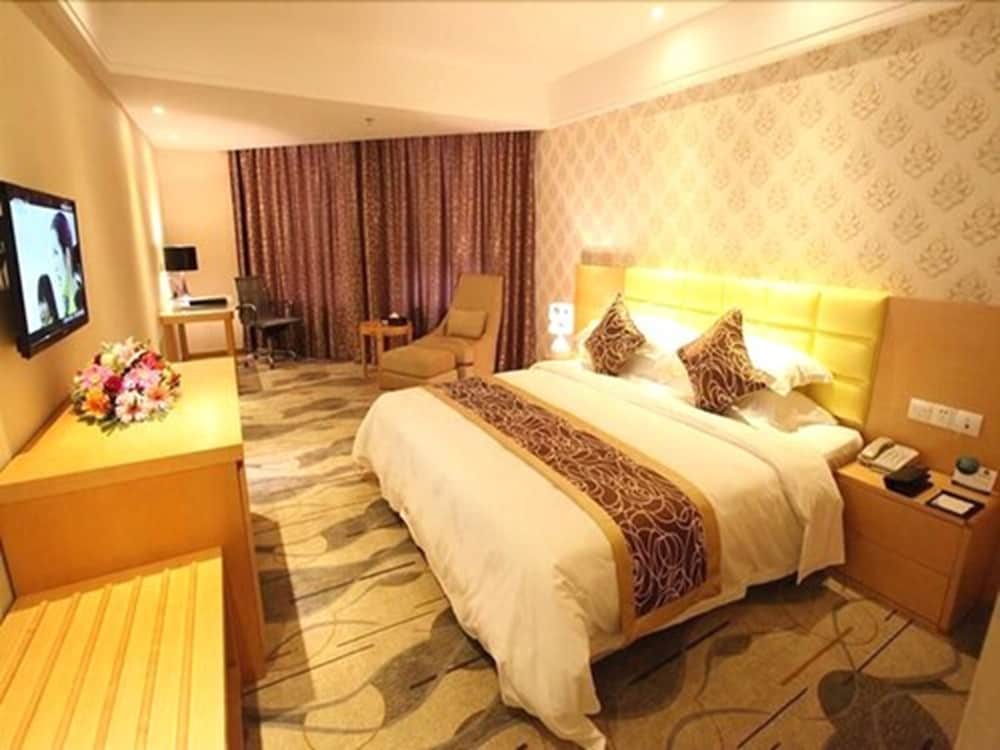 Фото New Beacon Xu Dong International Hotel