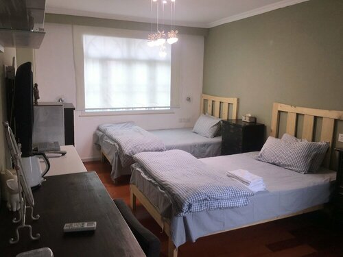 Гостиница LaozhouJia Hostel в Юньлоне