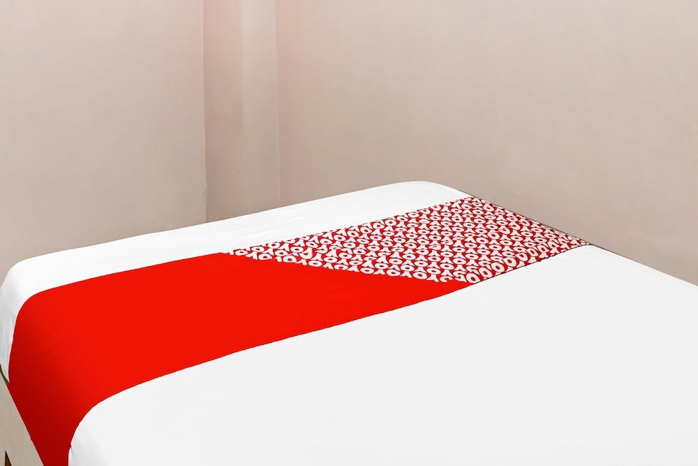 Фото Spot On 91336 Guesthouse Tarumanegara