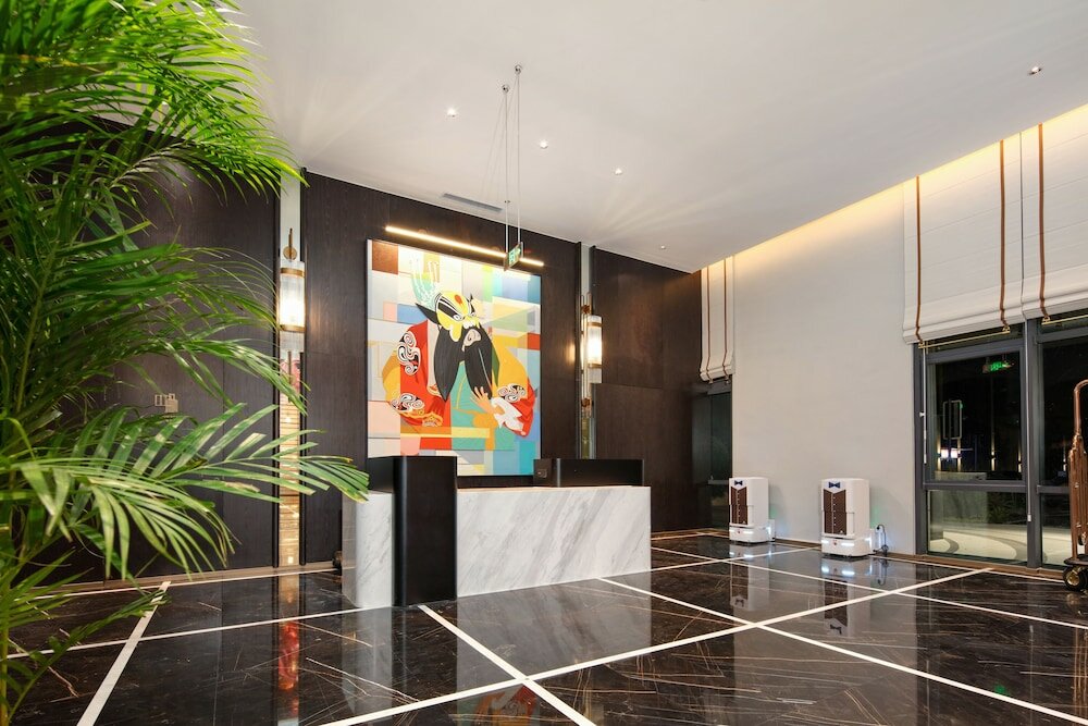 Фото Tiegang Jinjiangduchengjiudian