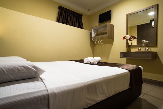 Фото Oyo 615 Dragon Inn Premium Hotel