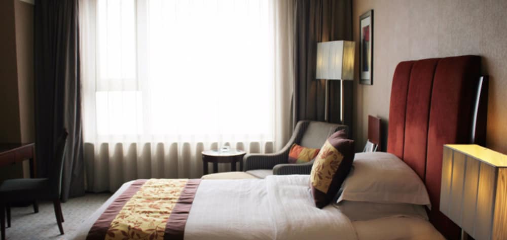 Фото Grand New Century Hotel Binhai Tianjin