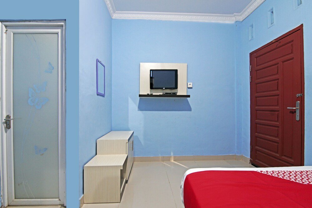 Фото Oyo 90752 Ridho Guest House Syariah