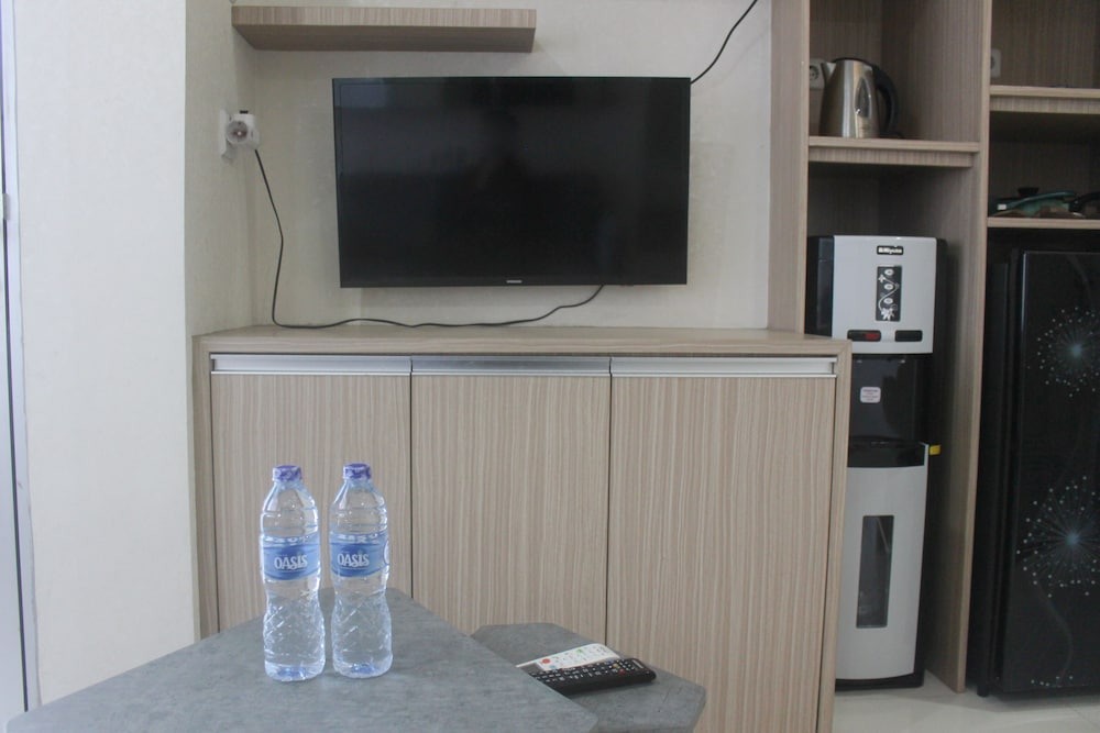 Фото Simple And Homey 2Br Apartment At Grand Asia Afrika
