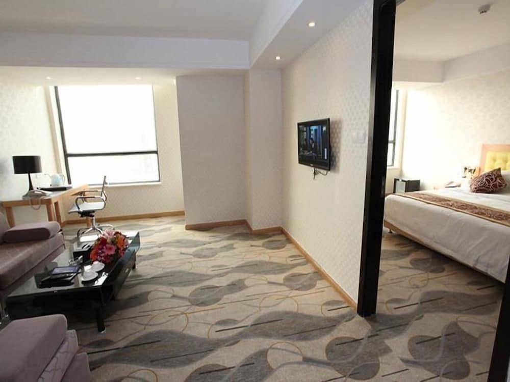 Фото New Beacon Xu Dong International Hotel