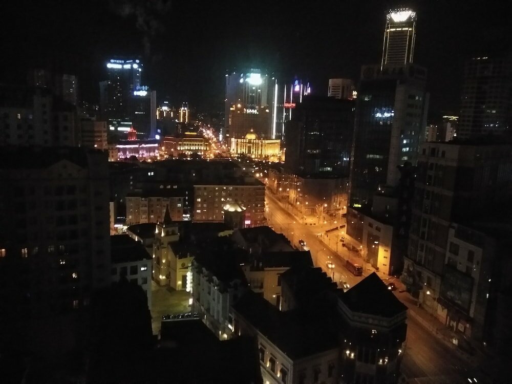 Фото Dalian Xiuzhu Building Apartment