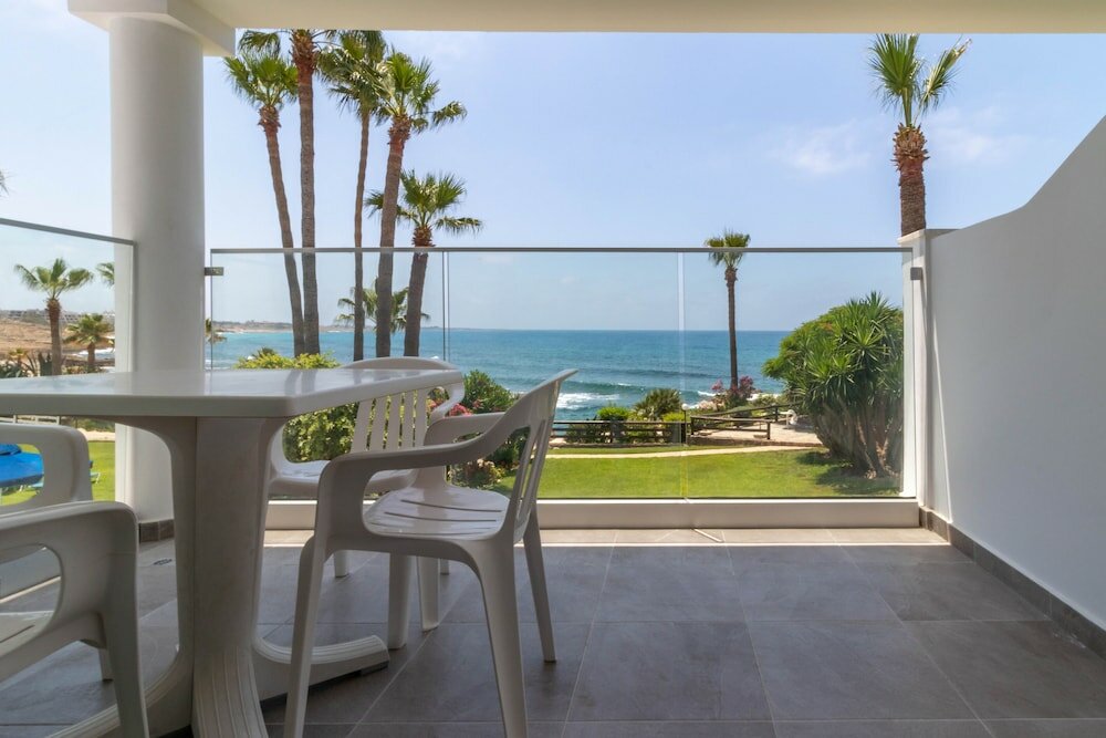 Фото Rododafni Beach Apartments