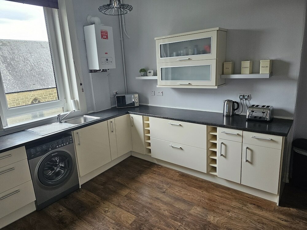 Фото Snug - Abhainn Apartment