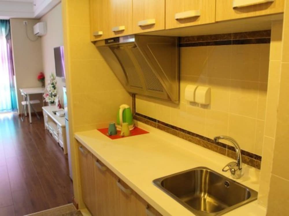 Фото Dalian Aolai Hotel Apartment