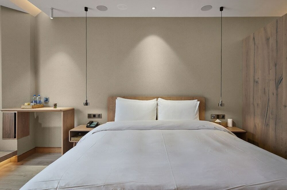 Фото Ebo Hotel Hangzhou Wulinmen