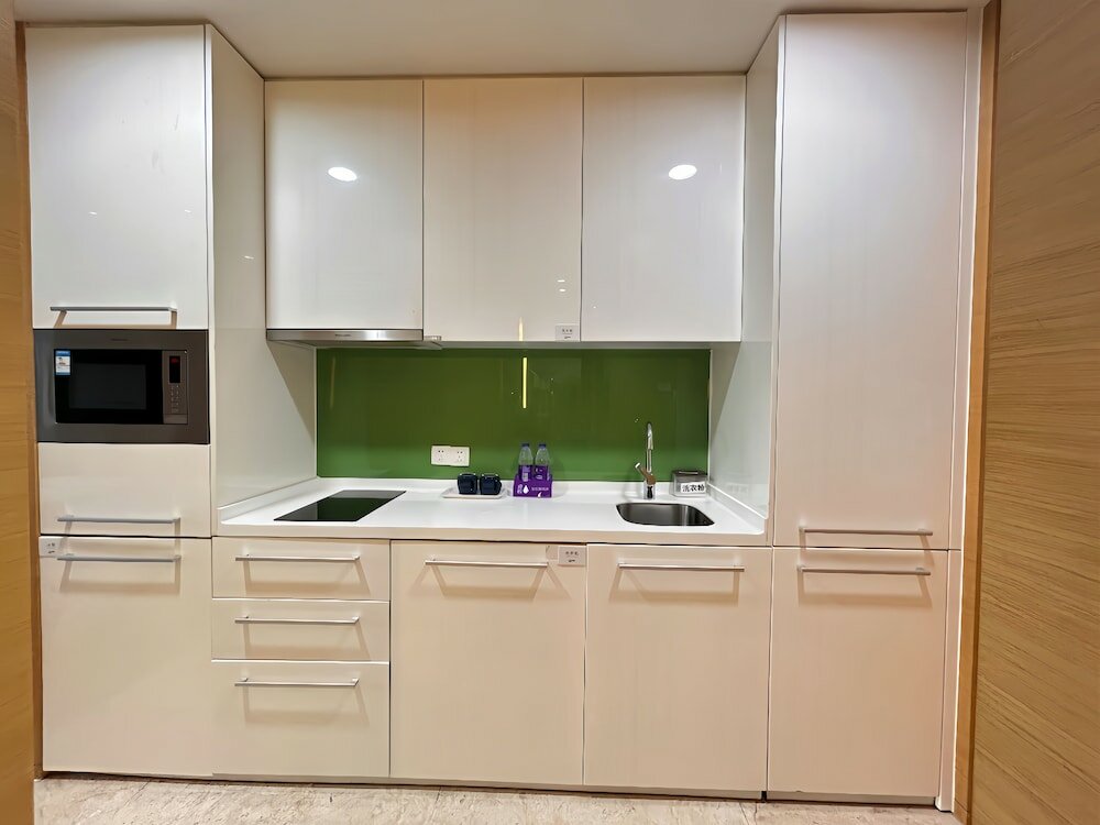 Фото Xingyi International Hotel Poly Store