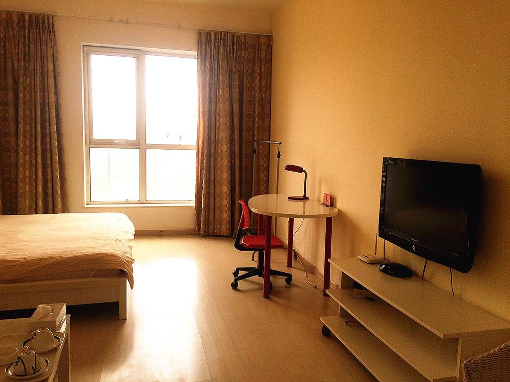 Фото China Sunshine Apartment Dacheng International